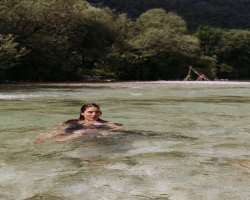 She enjoys swimming in natural waterfalls.